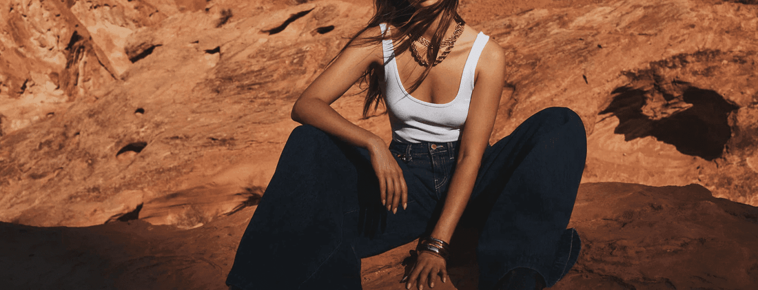 L’Agence wide-leg relaxed jeans – women’s designer denim styled with tank top in desert setting – shop wide & relaxed jeans at Steven Dann