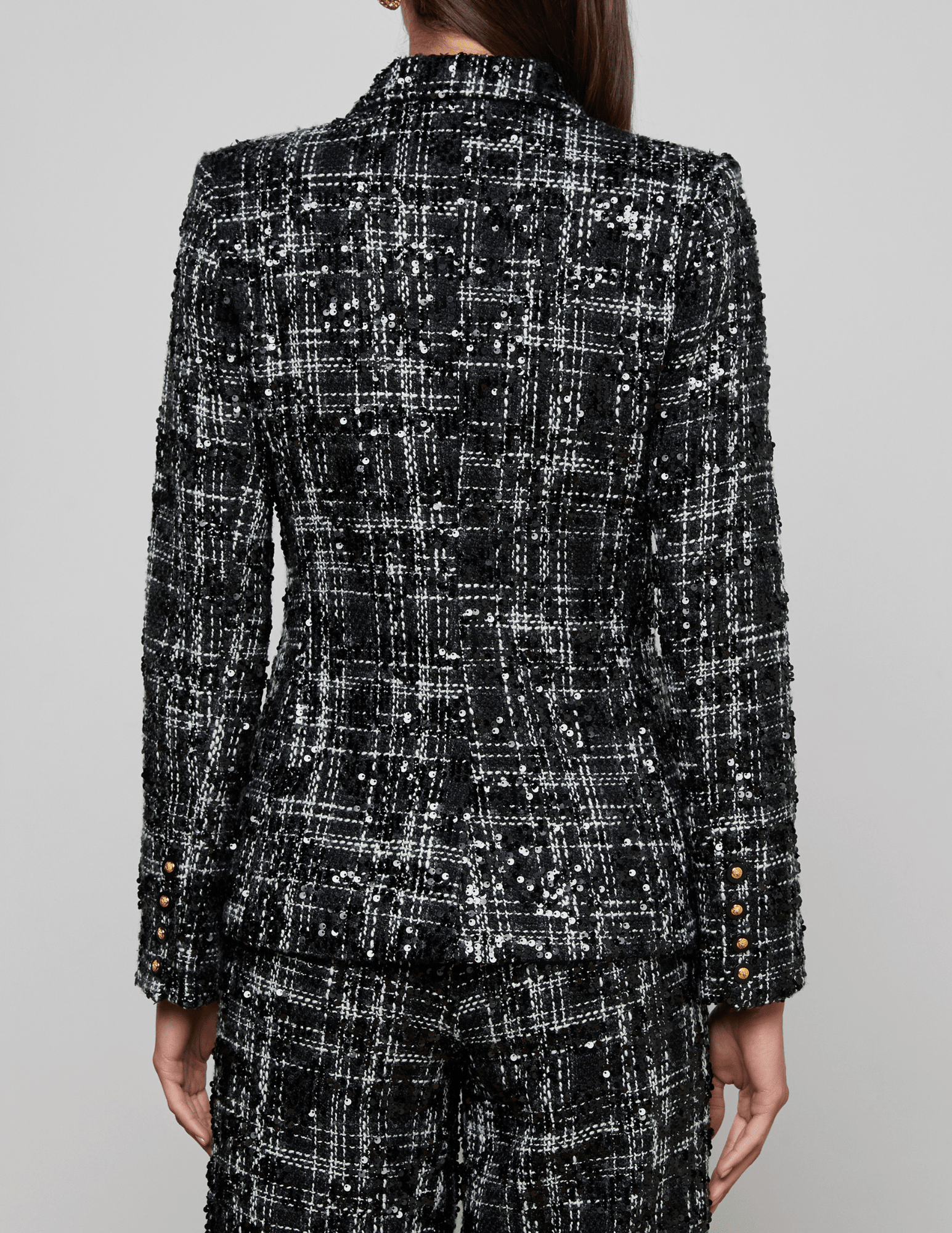 back view of 'AGENCE Colin Sequin Tweed Double Breasted Blazer in Black Ivory Tweed