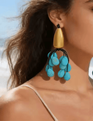 Austin Blaze Hedy statement earrings with turquoise beads and gold detail in model