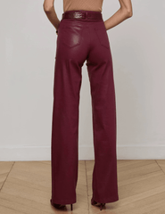 Back view of L’AGENCE Clayton High Rise Wide Leg Coated Jeans showing wide leg silhouette