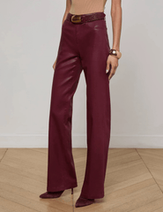 Side view of L’AGENCE Clayton High Rise Wide Leg Coated Jeans showing wide leg silhouette