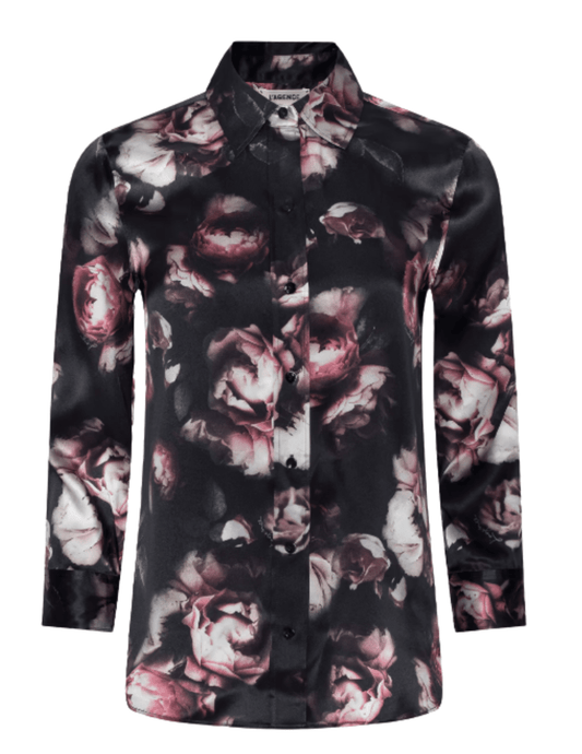 L'AGENCE Dani floral silk blouse showcasing its high-low shirttail hem and romantic distressed rose pattern.