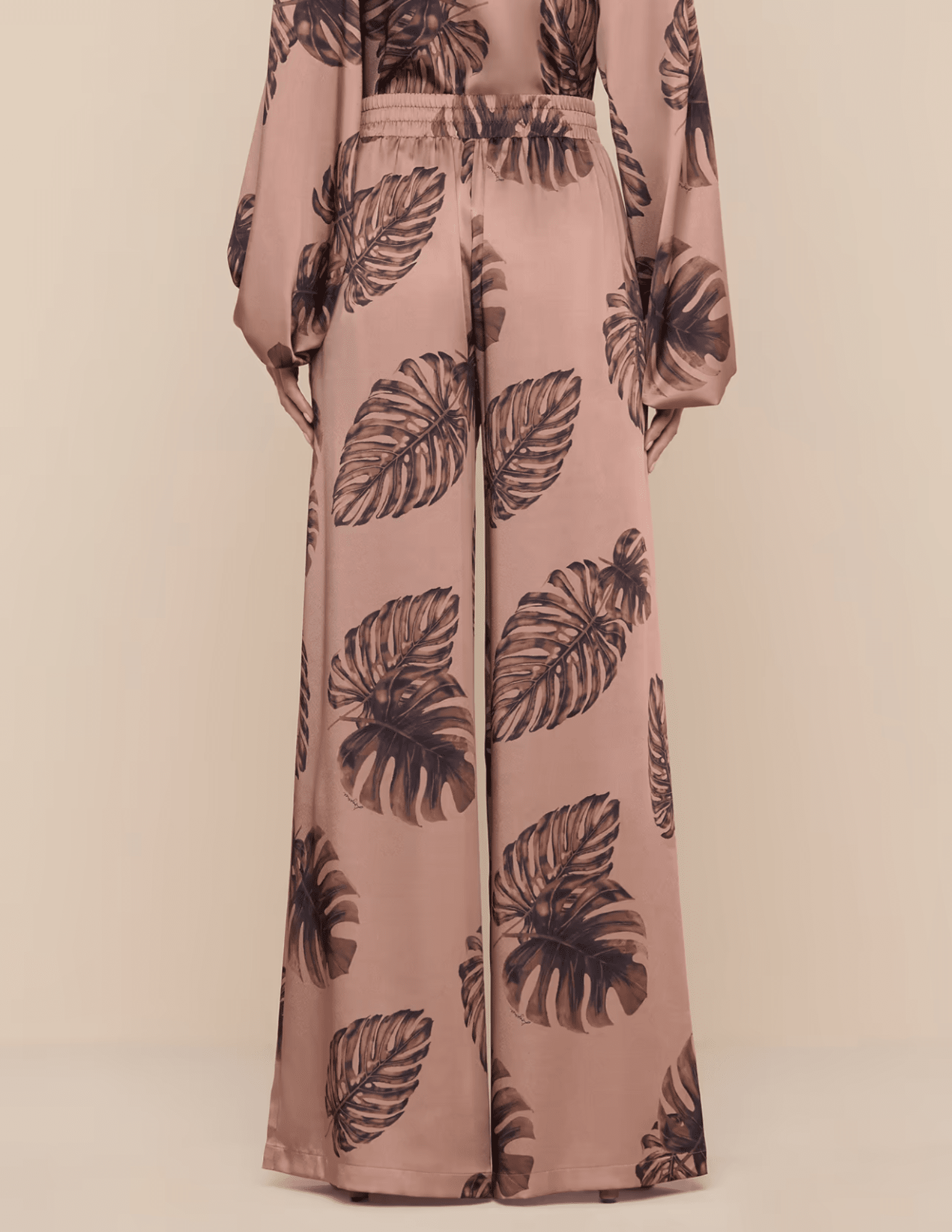 Back view of hazelnut palm print pants