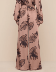 Back view of hazelnut palm print pants