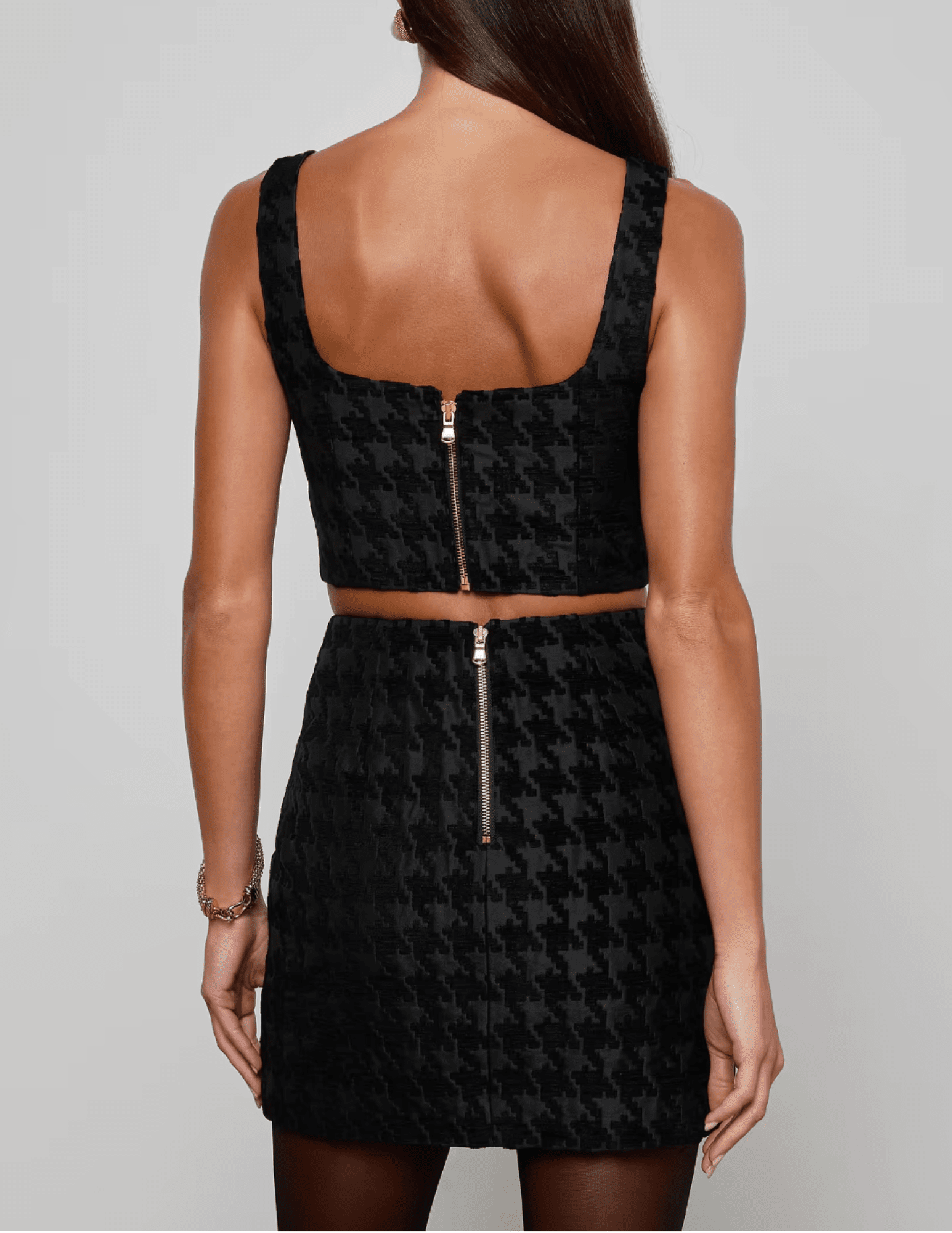 Back view of L’AGENCE Maylin Bralette Top featuring exposed zipper and cropped silhouette.