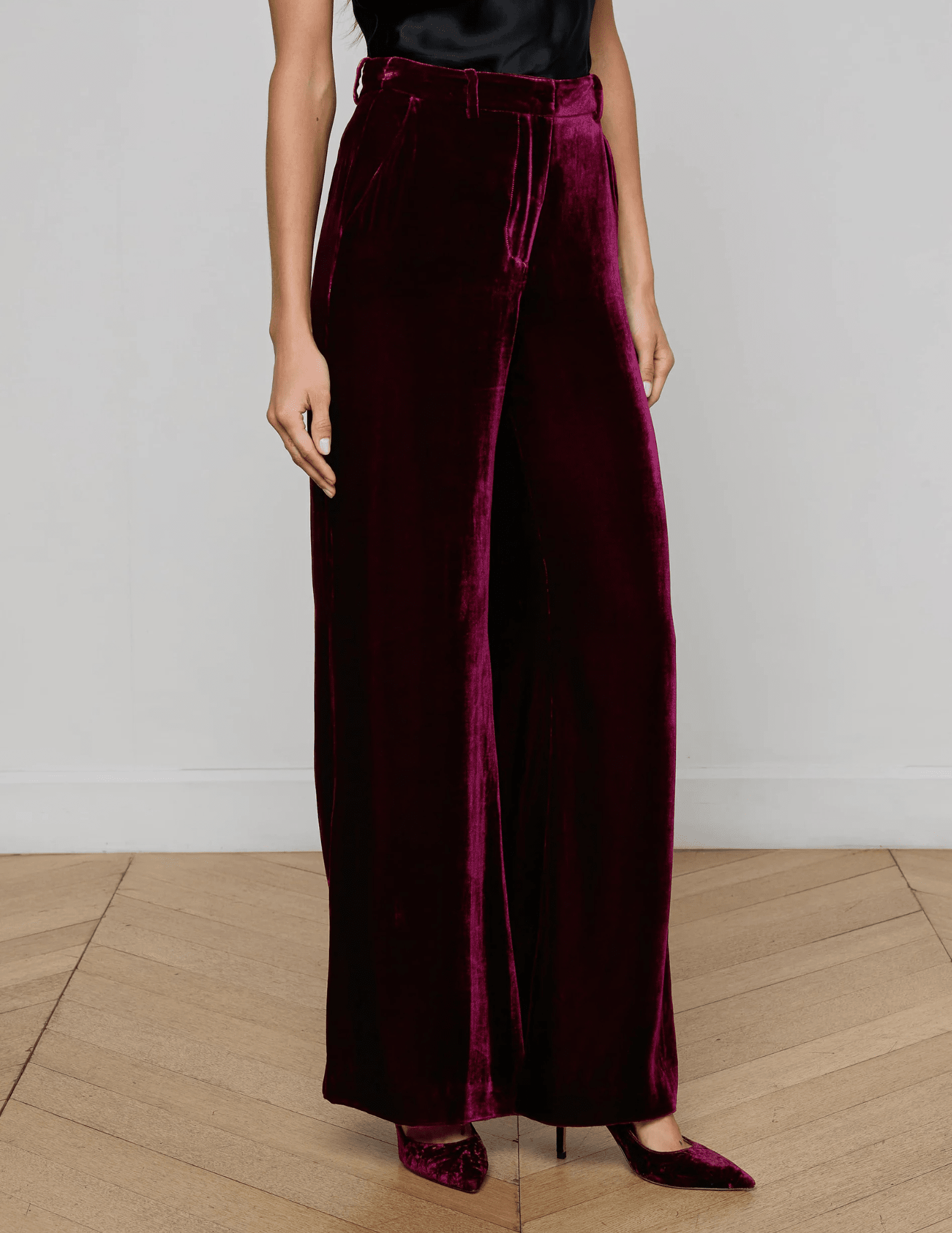 Side view of model in Dark Port Pilar Velvet Pant highlighting drape and fit