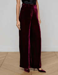 Side view of model in Dark Port Pilar Velvet Pant highlighting drape and fit