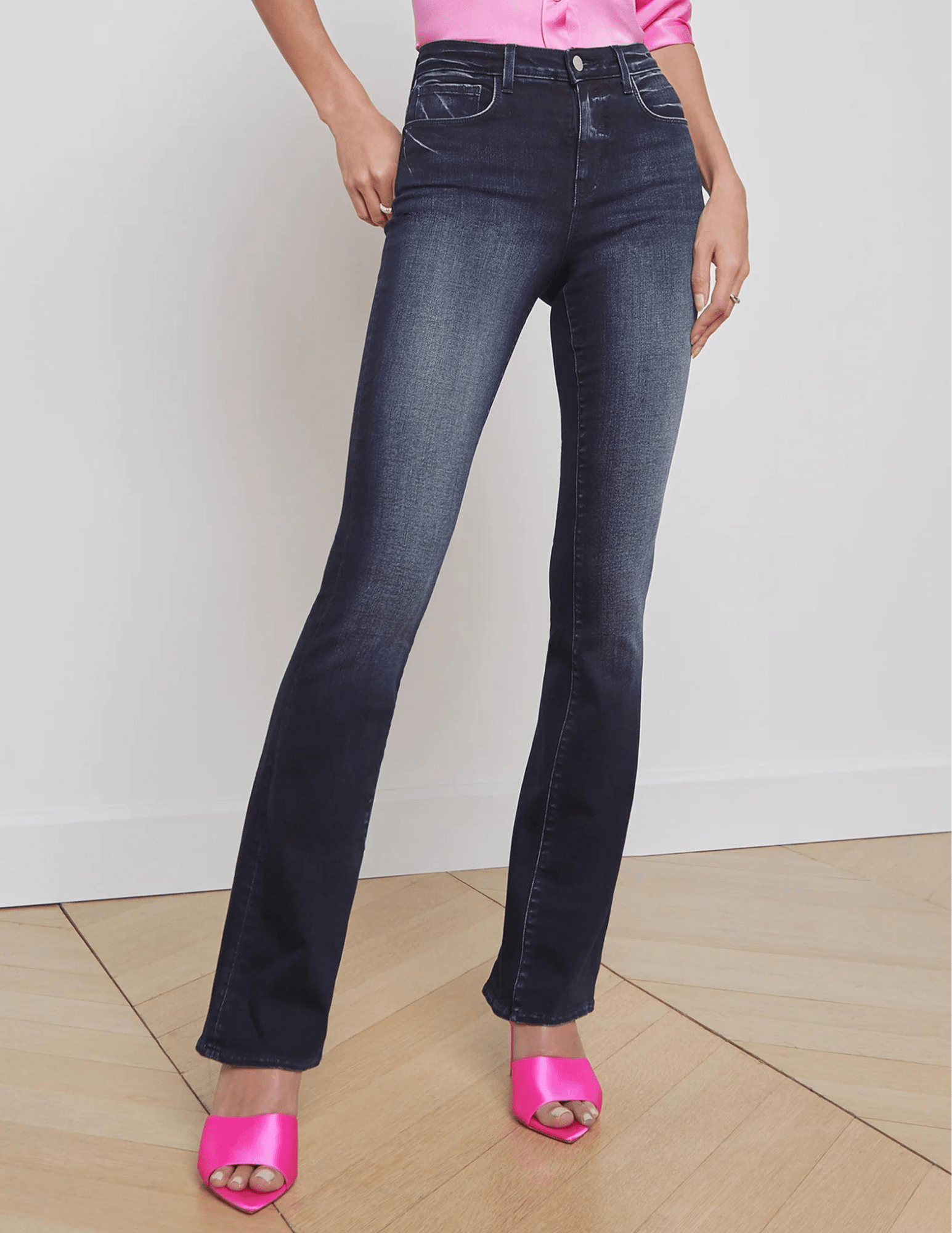 Model wearing L’Agence Selma High-Rise Baby Boot-Cut Jean Nightingale – high rise waist, slim bootcut leg