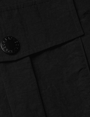 L'Agence - PRE-ORDER-L'AGENCE Norene Windbreaker Mini Skirt in Black - Buy Online