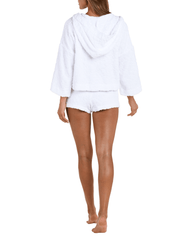 Back view of Model wearing L’AGENCE Amiya Terry Hot Short with matching cover-up top