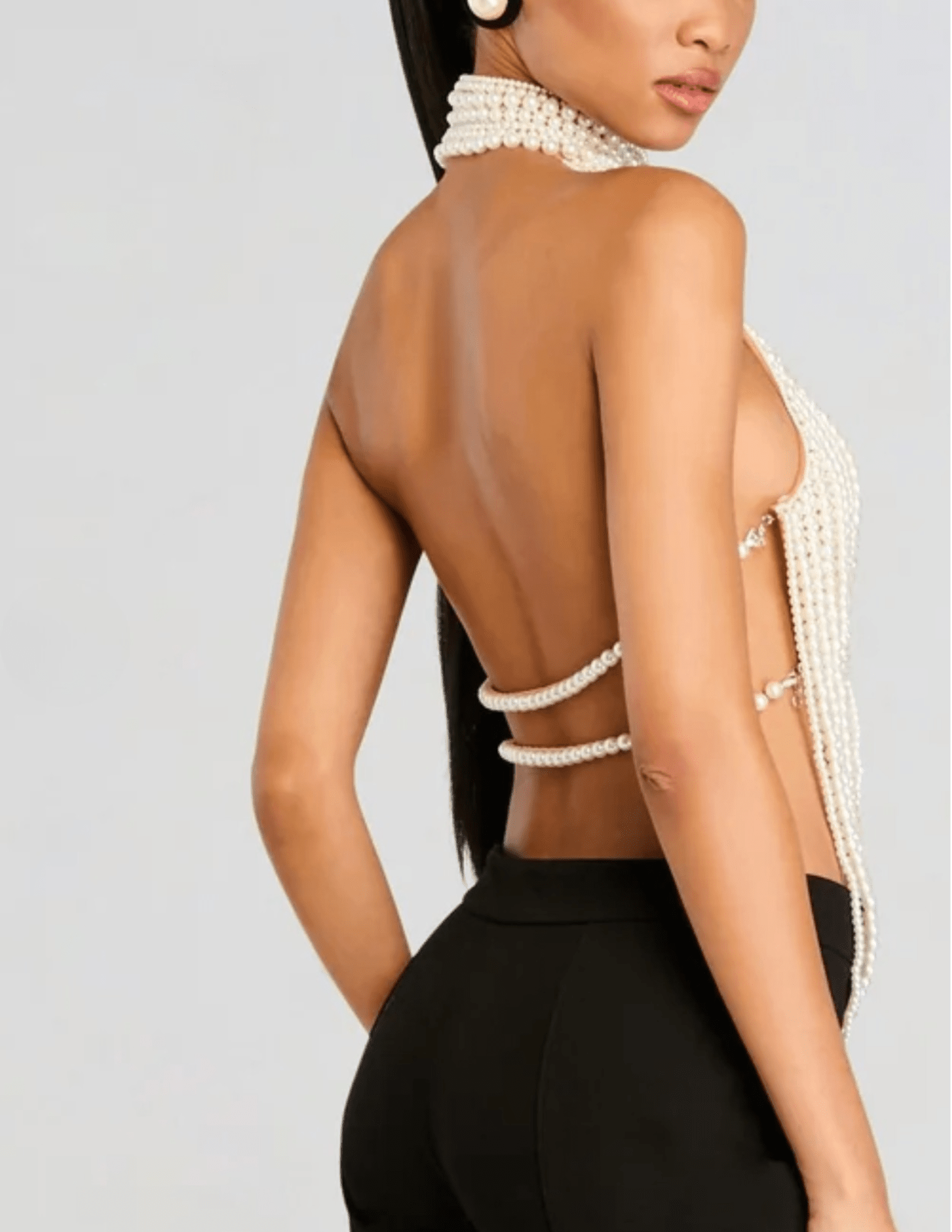 Back view of Retrofête Elsie top featuring open back with pearl strands