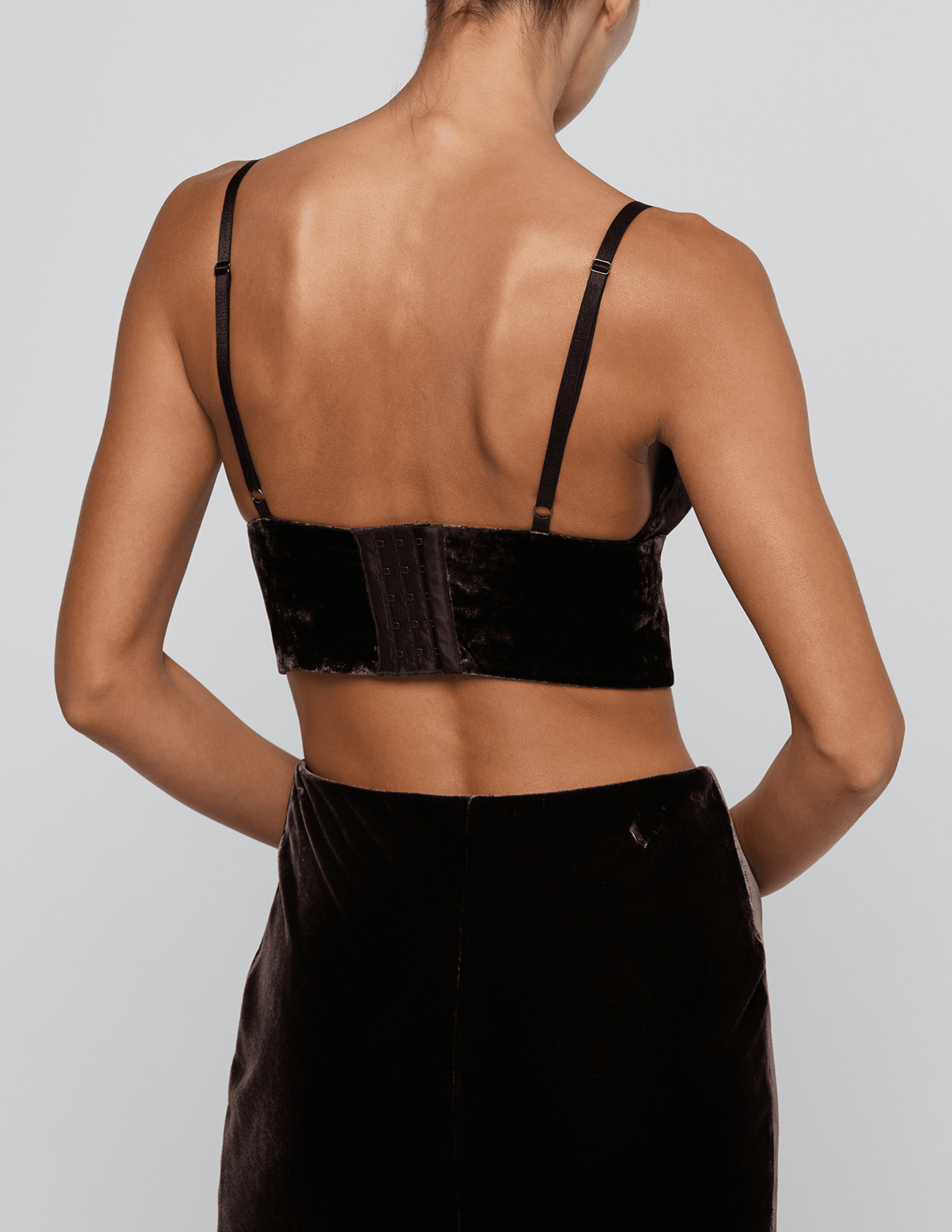 Back view of view of L'AGENCE Aislin Velvet Bralette Top in Dark Java