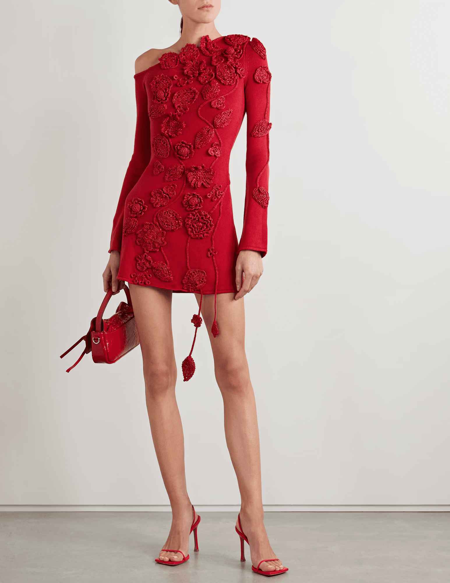 Front view of Cult Gaia Kaela Knit Appliqué Mini Dress in Merlot with 3D floral crochet.