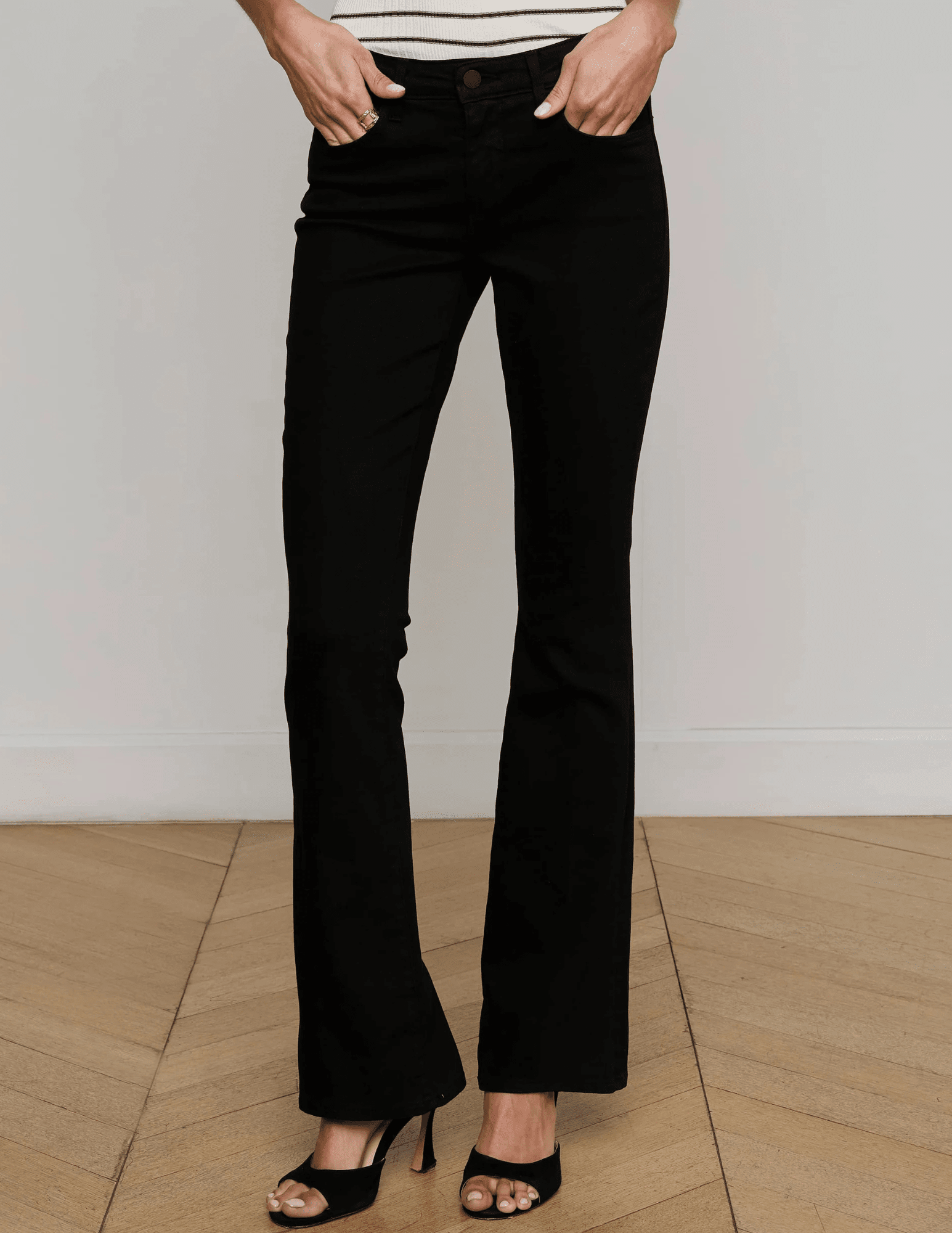 Font view of L’AGENCE Cara Low-Rise Bootcut Jeans in Noir