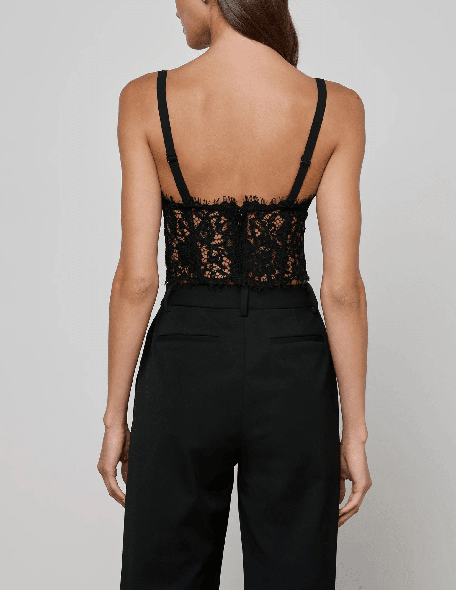 Back view of model wearing Raquel Lace Bustier with concealed zipper closure