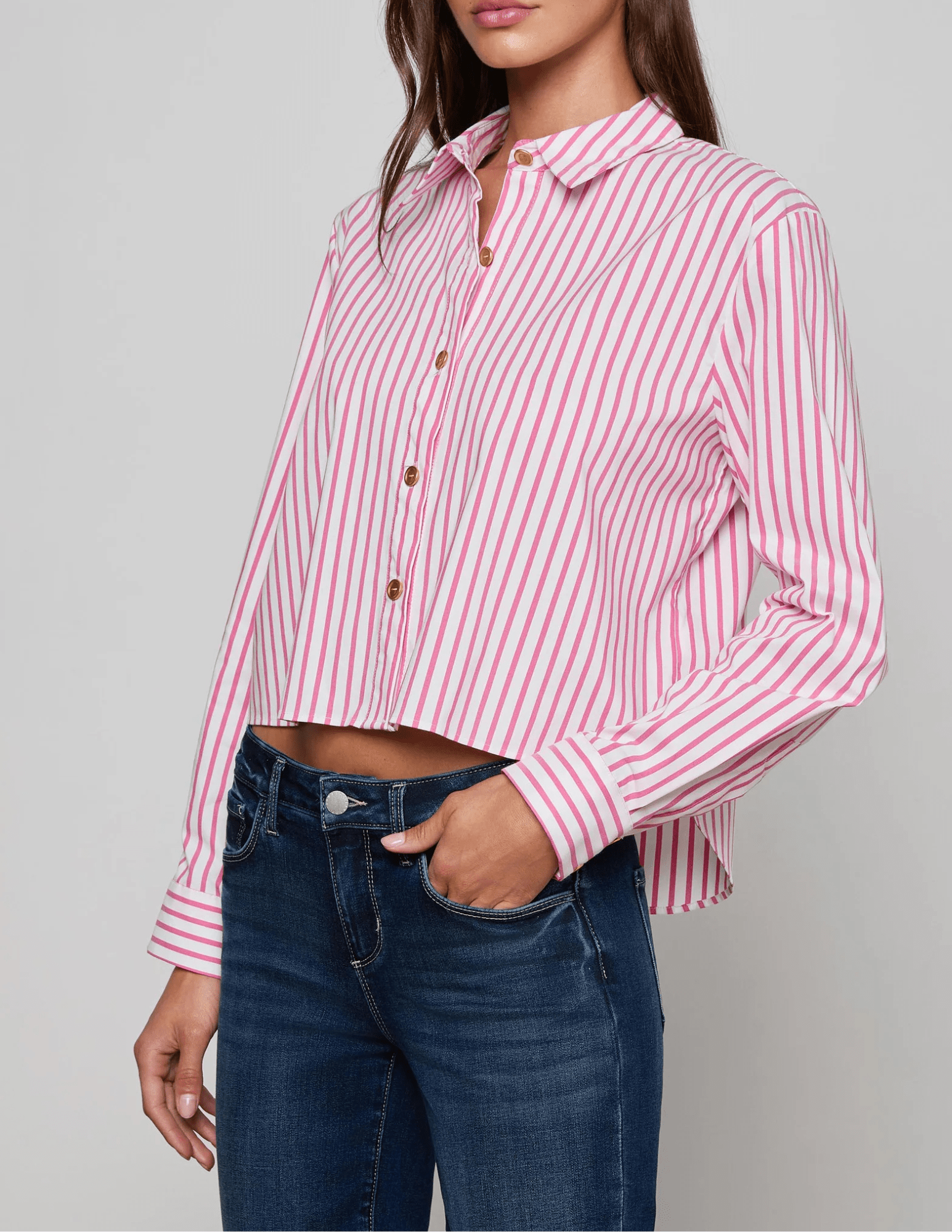 Side view of L'AGENCE Cosette Cropped High Low Blouse in Pinktober White Stripe
