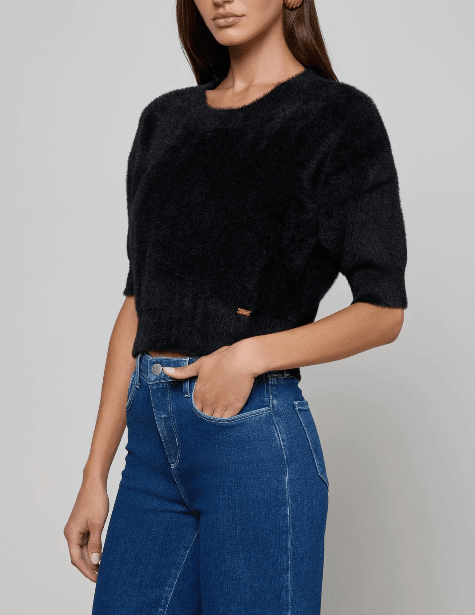 Side view of L'AGENCE Guinevere Short Sleeve Crop Sweater in Black
