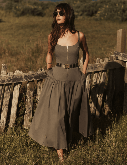 Model wearing L'AGENCE Rima Maxi Dress in Smokey Olive outside