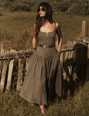 Model wearing L'AGENCE Rima Maxi Dress in Smokey Olive outside