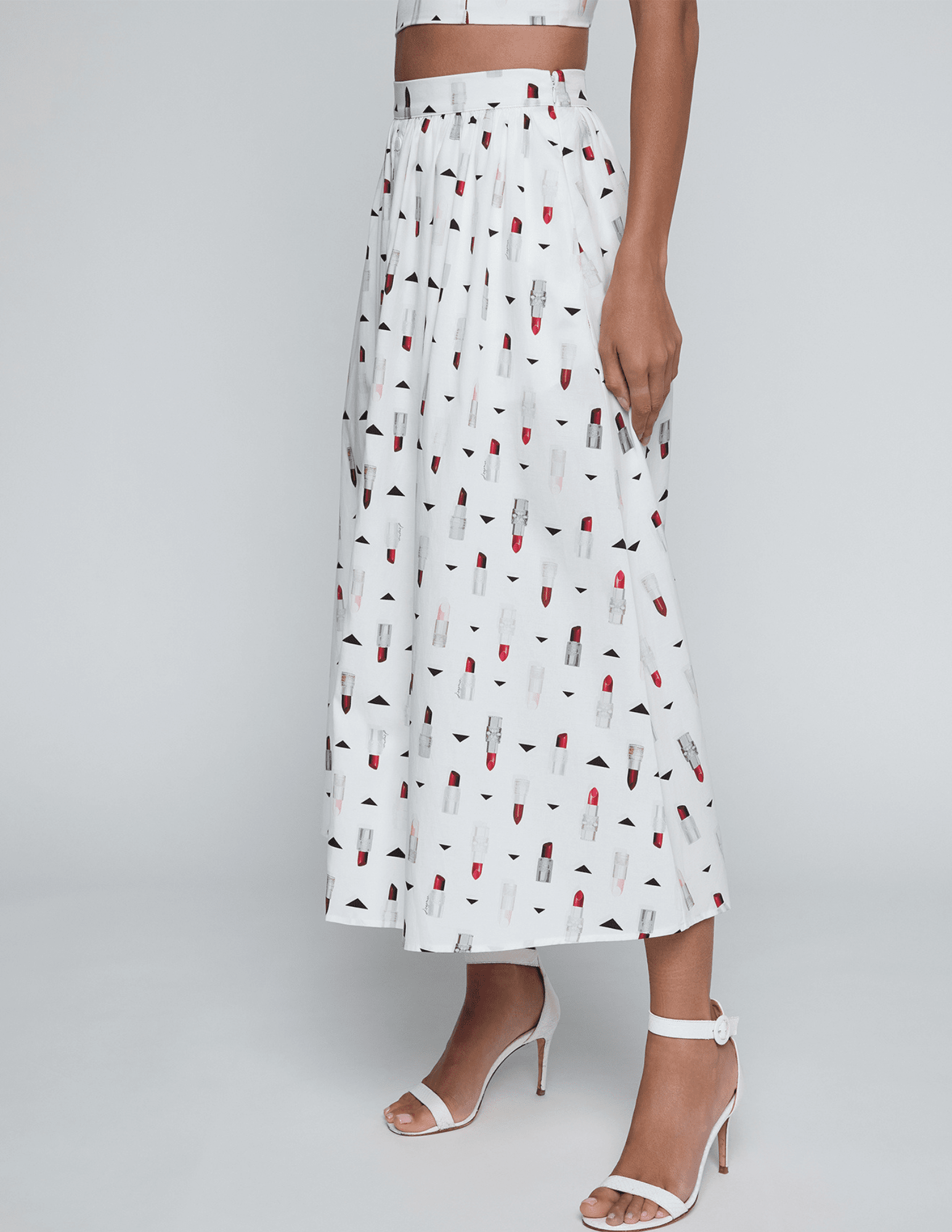 Side view of L'AGENCE Seina Poplin Midi Skirt in Ivory Multi Lipstick Geo