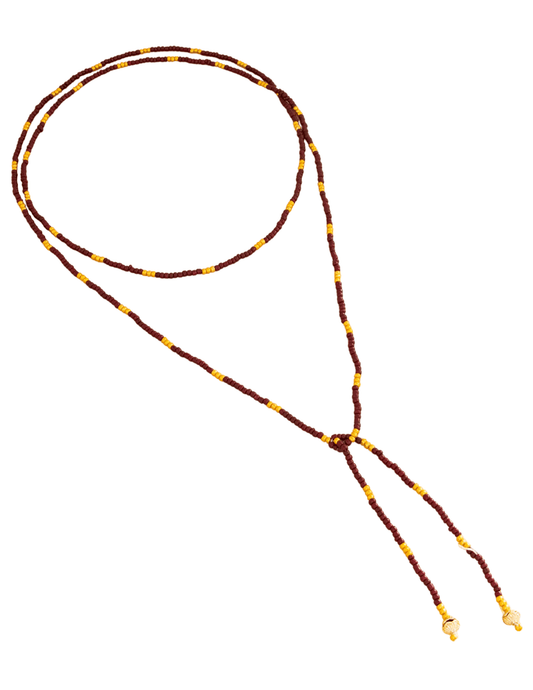 Long burgundy and gold beaded wrap necklace styled layered