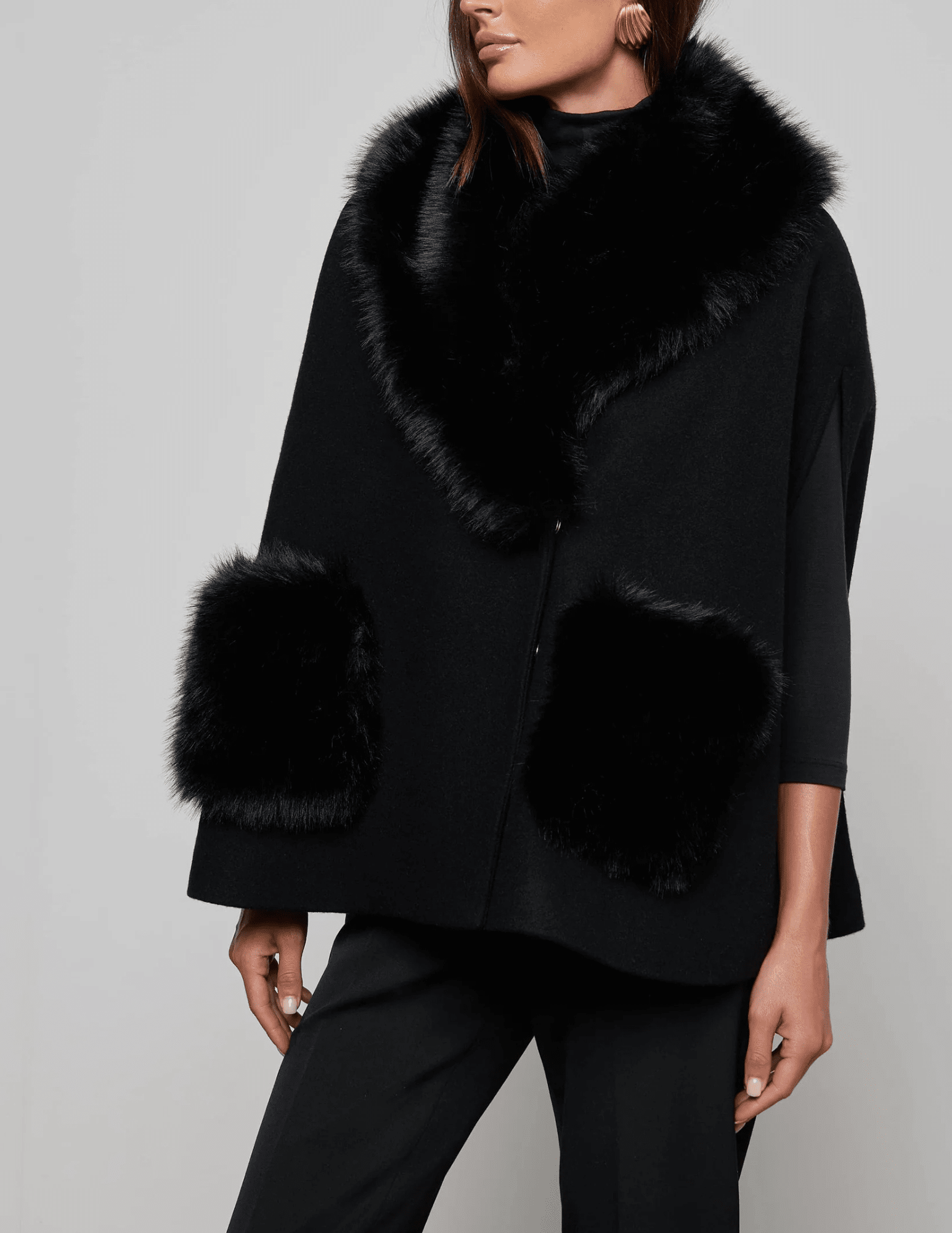 Side view ofL'AGENCE Chana Faux Fur Collar Cape in Black

