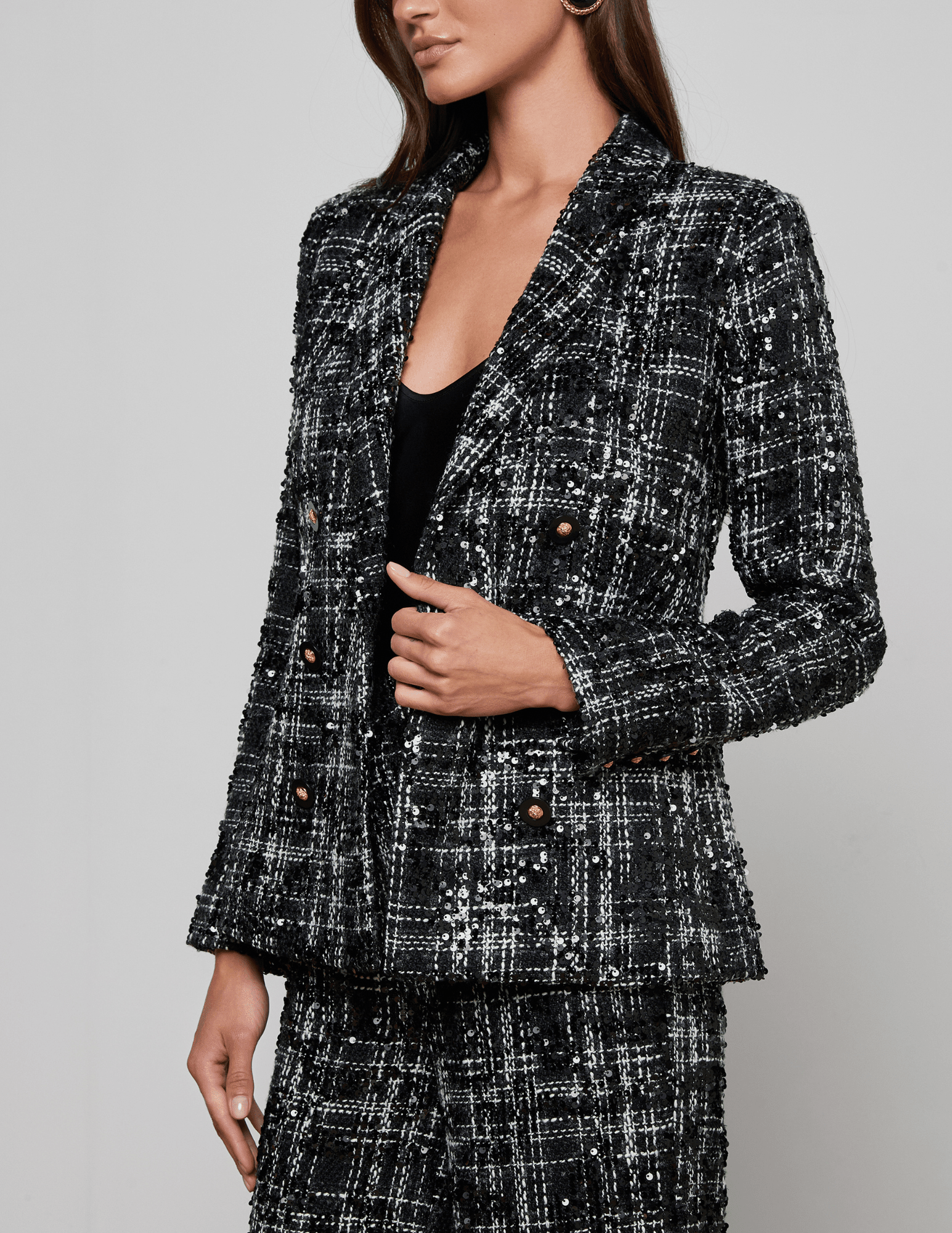 Side view of 'AGENCE Colin Sequin Tweed Double Breasted Blazer in Black Ivory Tweed
