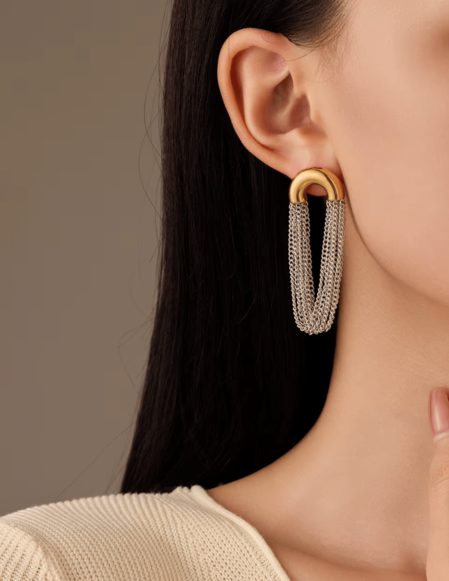 Model wearing Austin Baze Cleo Two-Tone Chain Earrings in silver and gold.