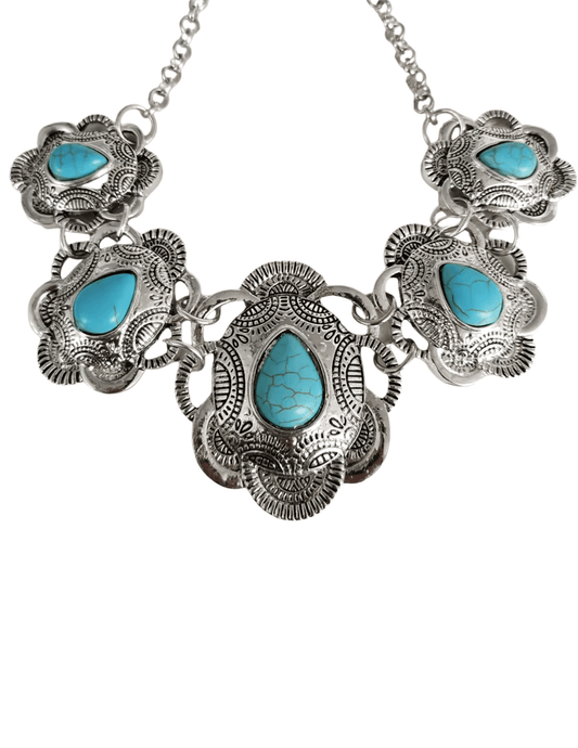 Close-up of Austin Blaze Agatha Necklace with turquoise concho pendants.
