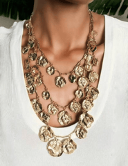 Layered bohemian gold coin charm necklace with adjustable lengths"