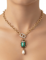 Austin Blaze Gypsy Beetle Necklace with gold-tone chain and green beetle pendant neck