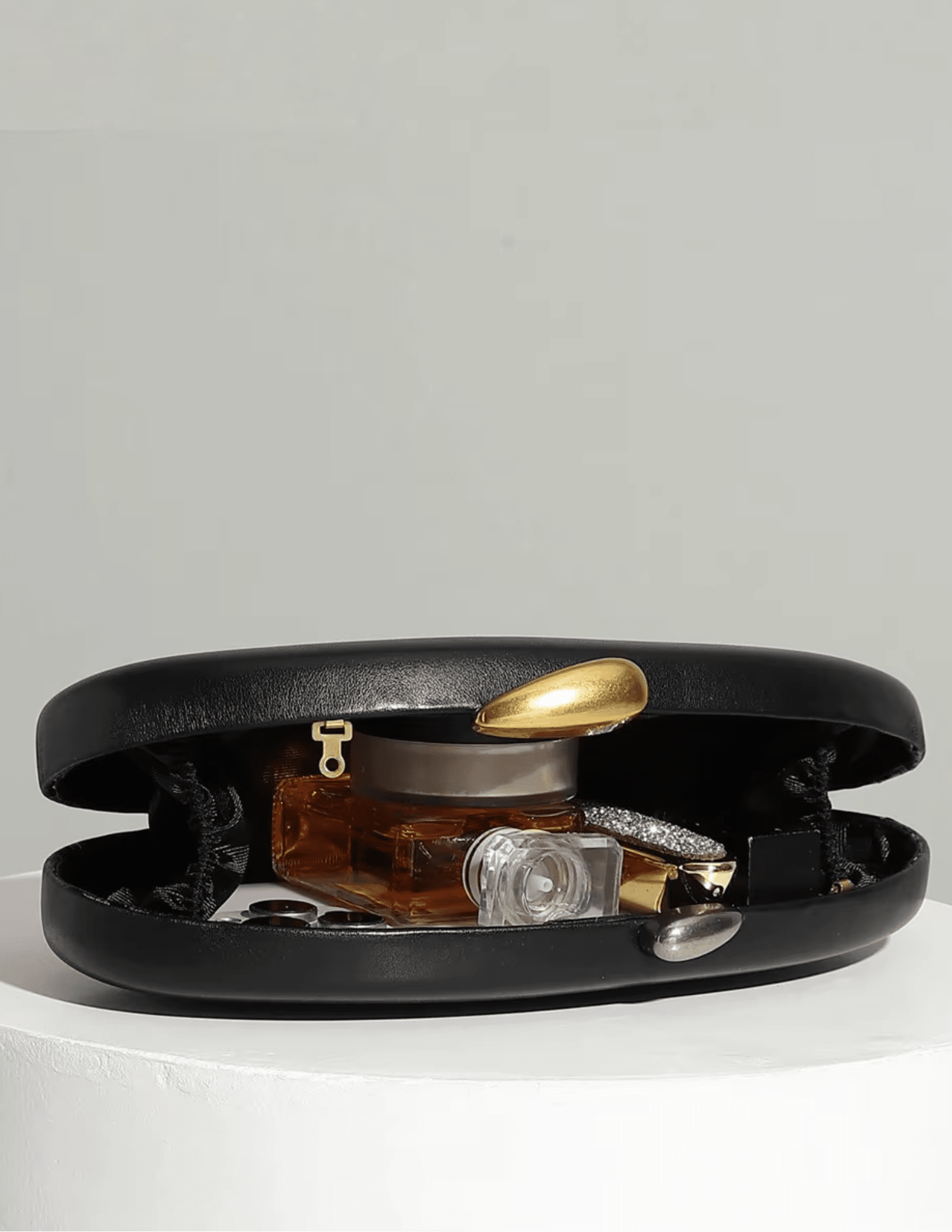 Austin Blaze Pimm sculptural clutch in black vegan leather open