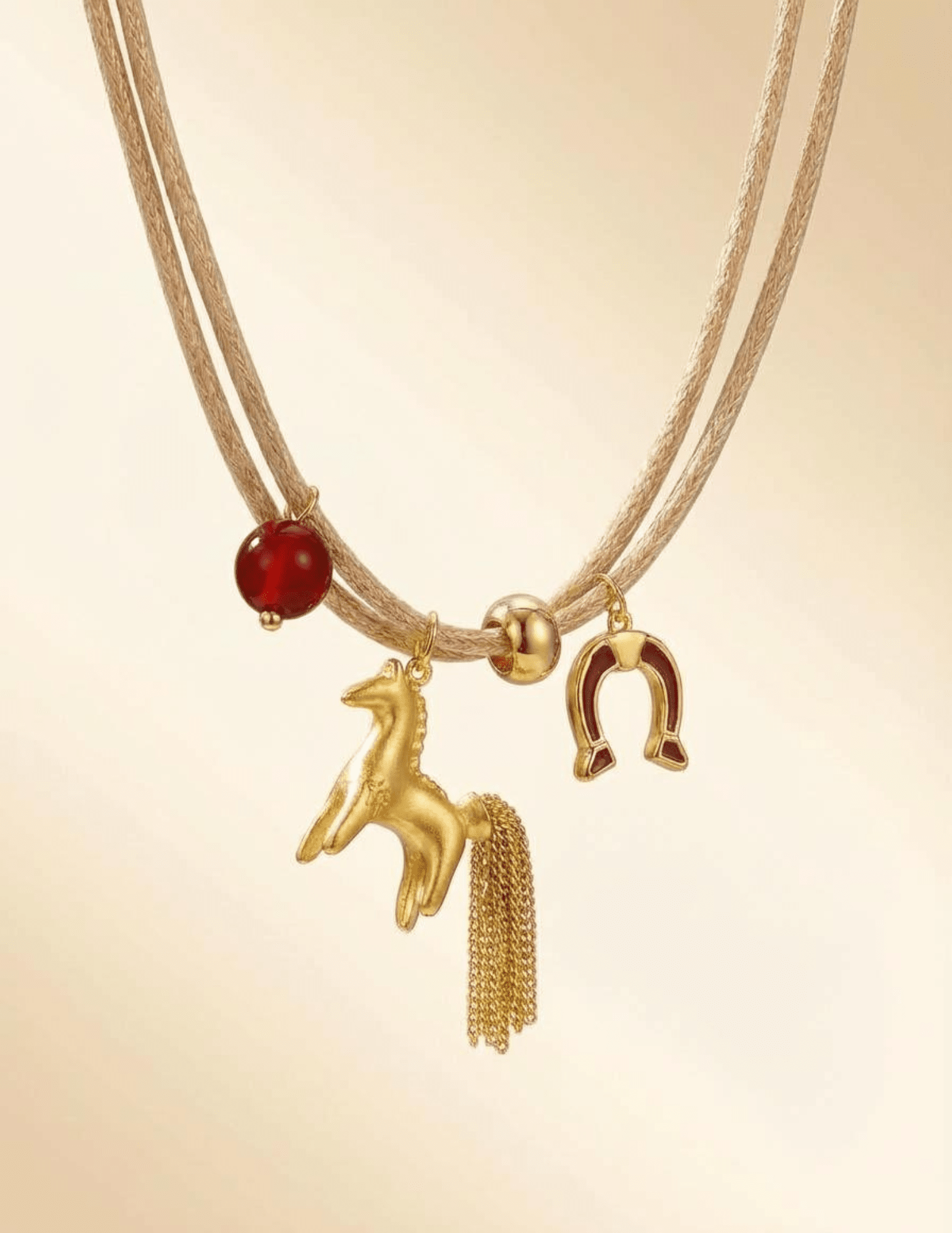 Gold horse charm detail on Austin Blaze Shyla necklace