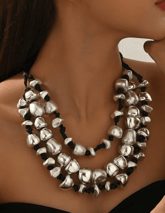 Model wearing Austin Blaze Zya multi-layer beaded necklace