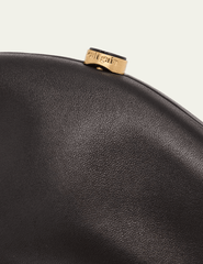 Cult Gaia Caldera Clutch in black leather with gold-toned clasp
