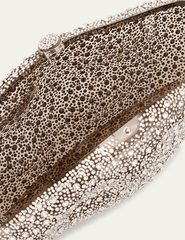 “Sculptural clear clutch with silver-tone clasp and textured glass detailing
