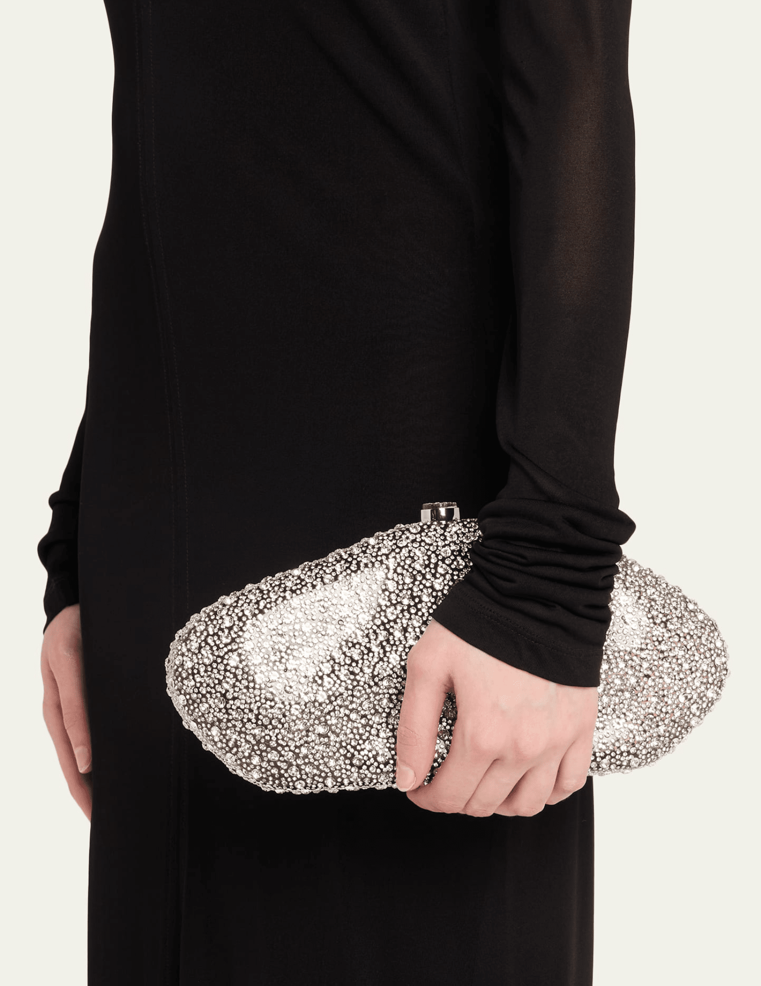 Cult Gaia crystal-inspired clutch styled with black evening outfit.