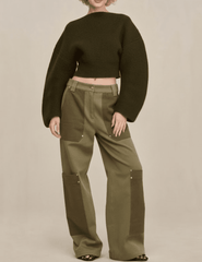 Model wearing Cult Gaia Ella Rounded Sleeve Sweater in rosemary cropped knit