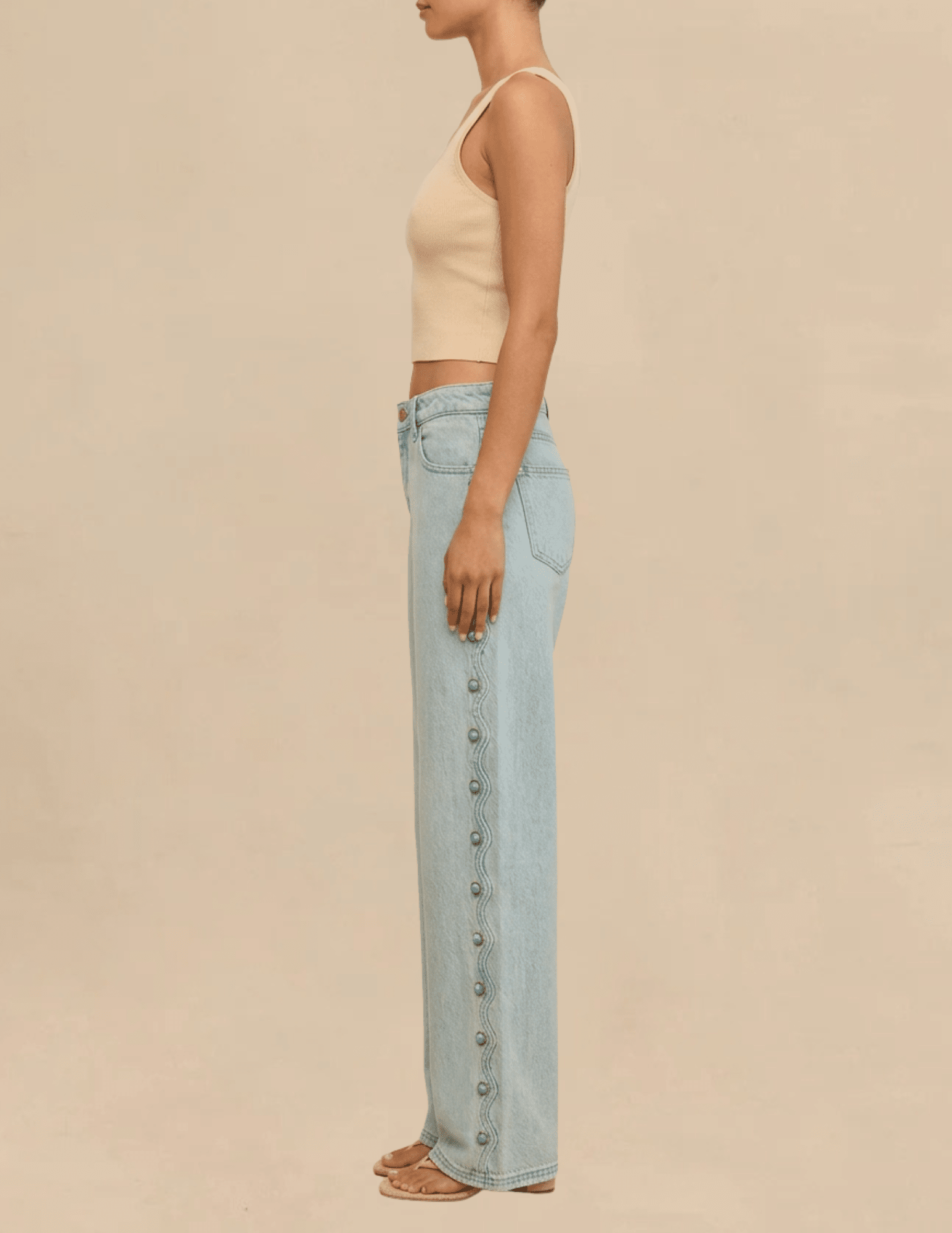 Side view of the Cult Gaia Elphie Low Rise Studded Jeans in Vintage Warm