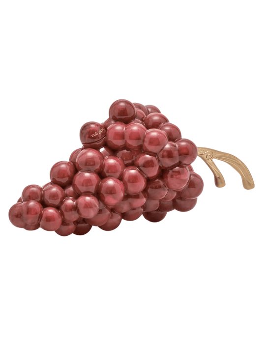 Side view of sculptural acrylic grape clutch by Cult Gaia.