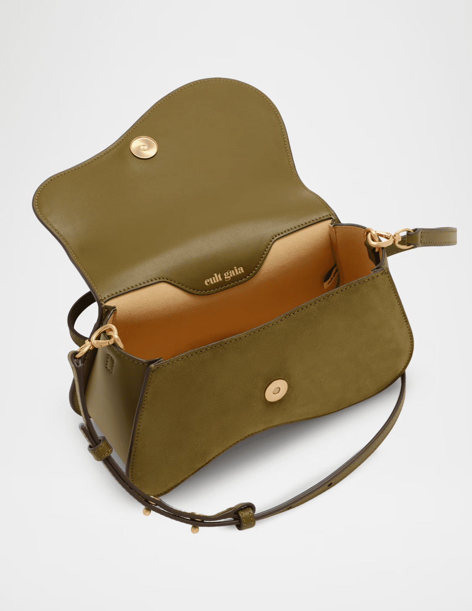 Interior view of Cult Gaia Kazia Crossbody Bag in Rosemary showing magnetic closure and lined compartment.
