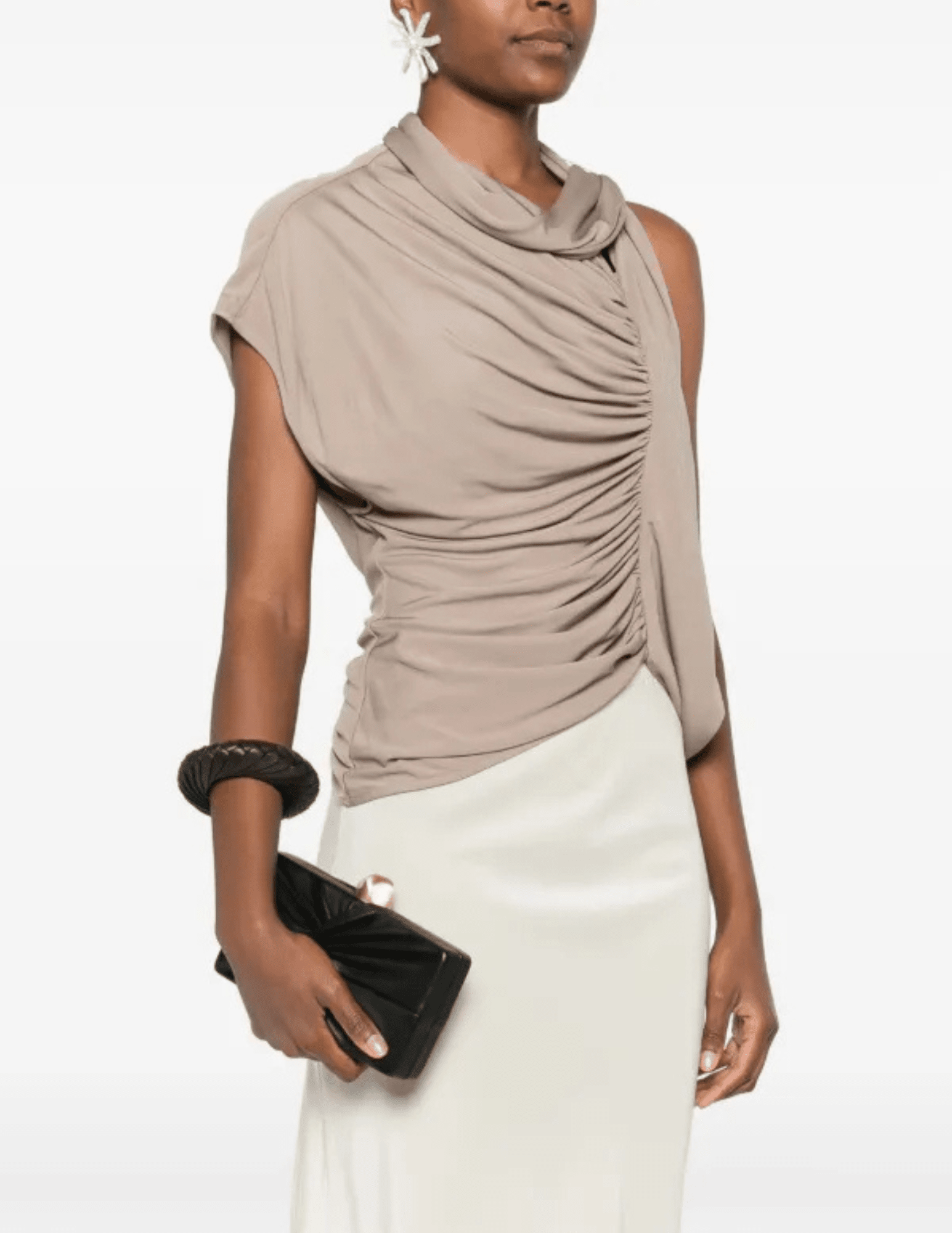 Model holding black Cult Gaia Lisse Clutch with gold hardware.