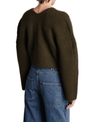 Back view of Cult Gaia Mayalu Chain Sweater in Deep Rosemary