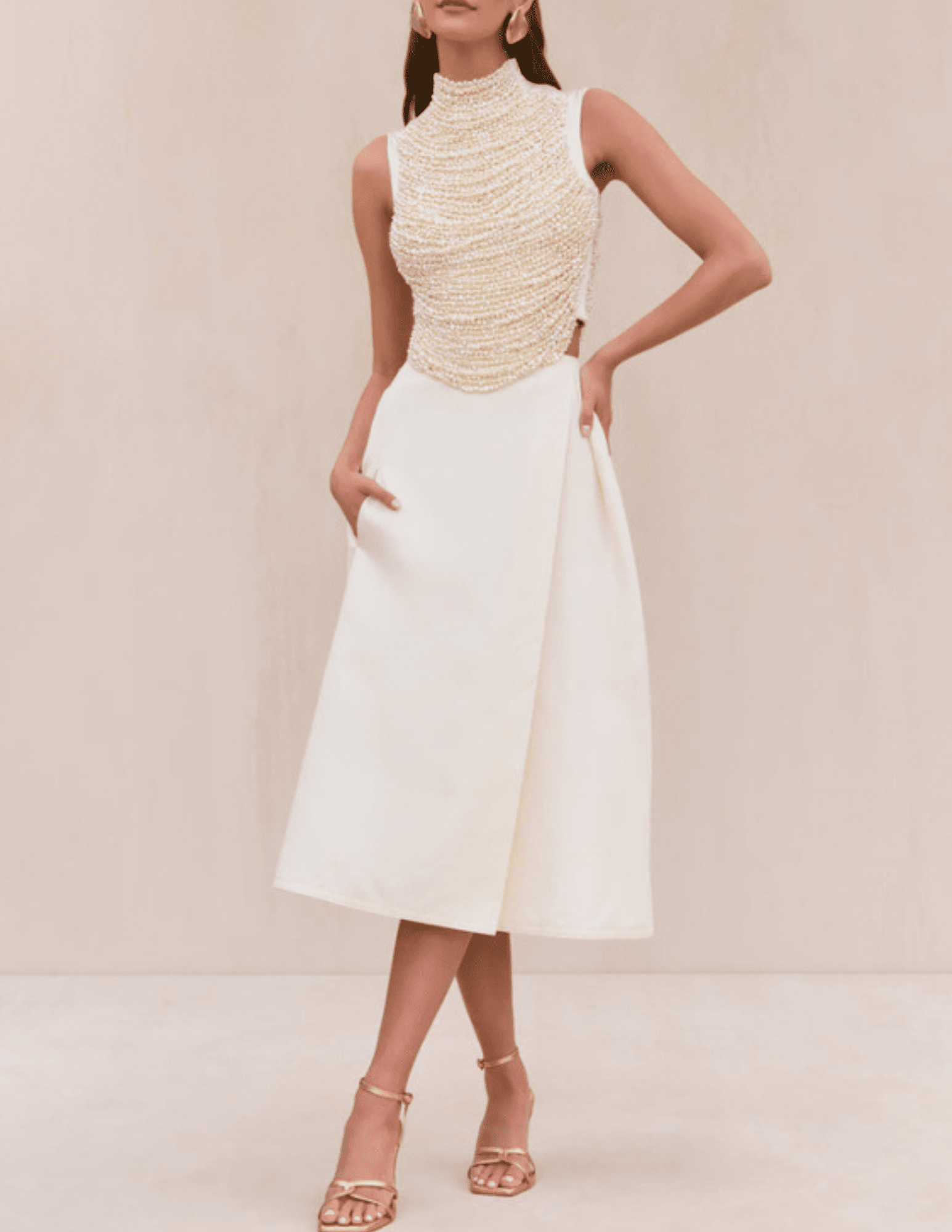 Model wearing Cult Gaia Taraji Pearl Top with turtle neckline and beaded design