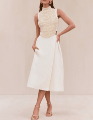 Model wearing Cult Gaia Taraji Pearl Top with turtle neckline and beaded design