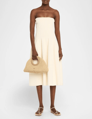 Cult Gaia natural woven top handle bag styled with summer outfit