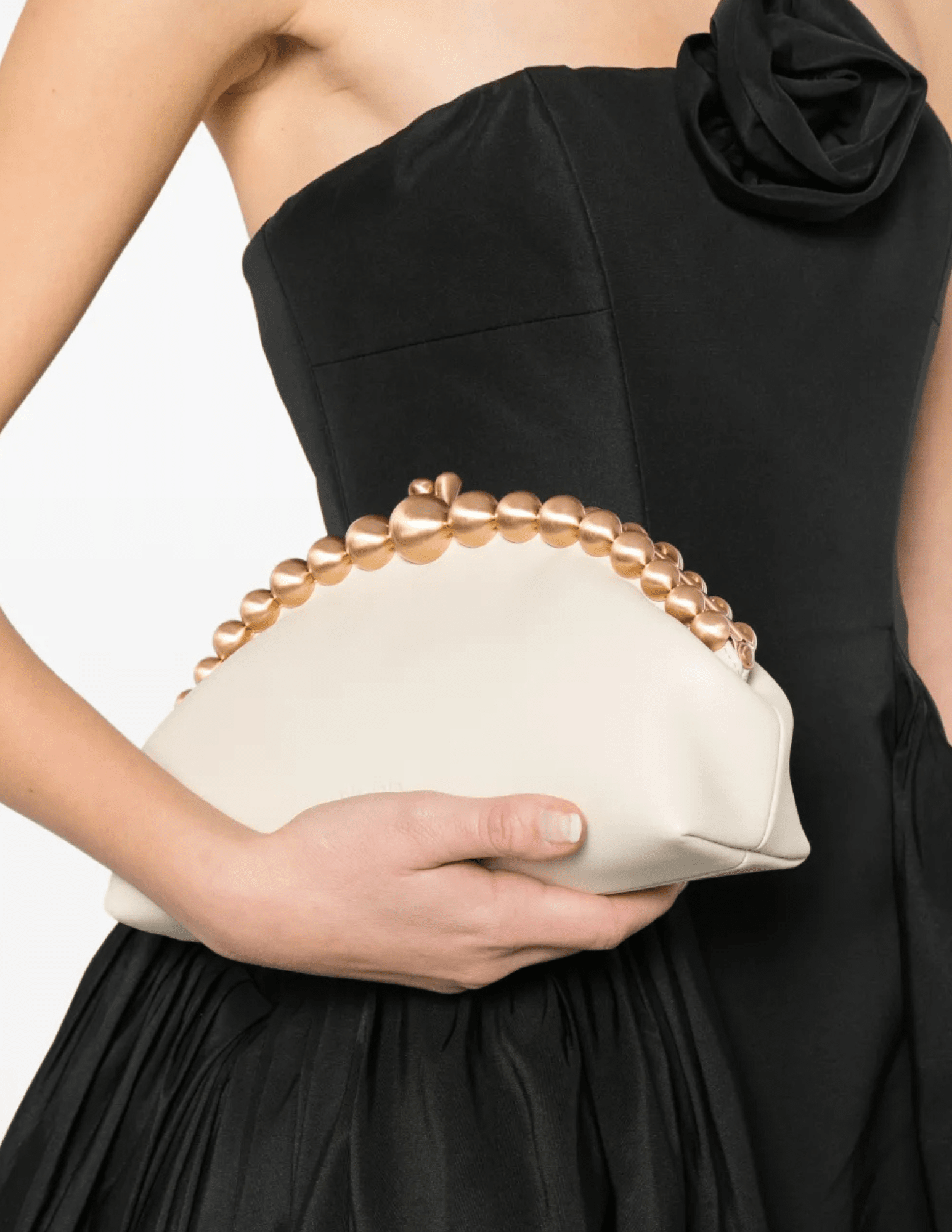 Model holding Cult Gaia Una Clutch evening bag