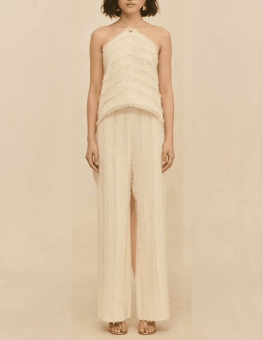 Front view of the Cult Gaia Venezia Halter Cascade Top in Off White worn on a model