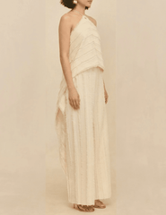Side view of the Cult Gaia Venezia Halter Cascade Top in Off White highlighting the flowing silhouette