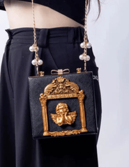 Model wearing Fleur de Camélia Evangeline Box Bag with pearl chain strap
